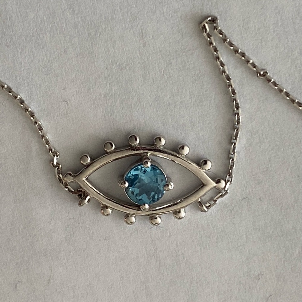 Silver chain, evil eye with turquoise stone, never worn.